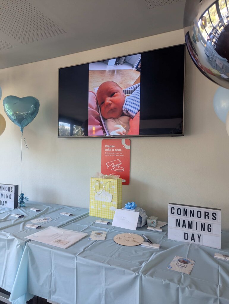 slideshow-showcase-on-a-television-during-the-baby-naming-ceremony-of-connor-at-shortland