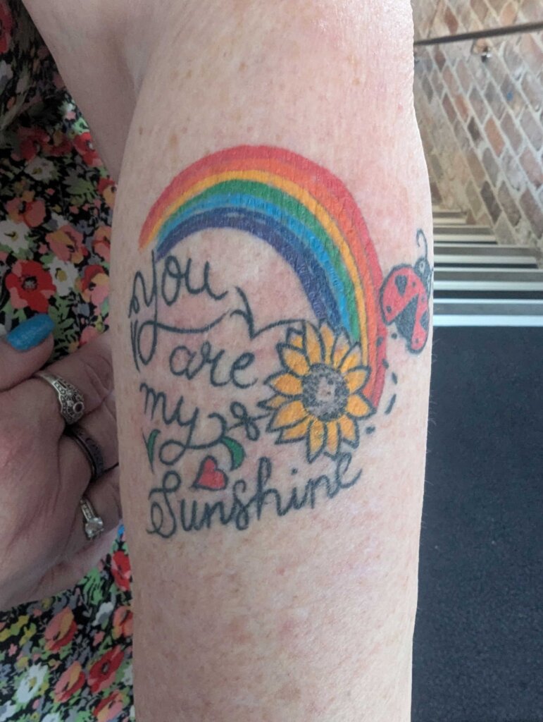 rainbow-tattoo-in-honor-of-connor-during-his-baby-naming-ceremony-at-shortland-celebrated-by-julie-muir