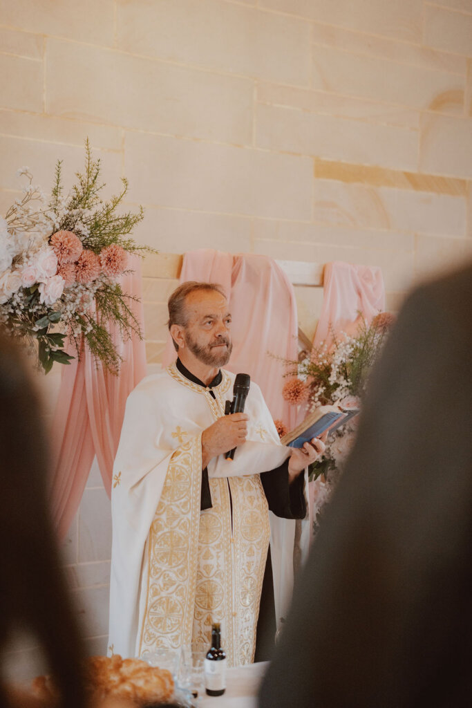 priest-at-the-altar-rachel-and-nick-macedonian-wedding-co-hosted-by-julie-muir-at-the-peterson-house-in-hunter-valley-australia