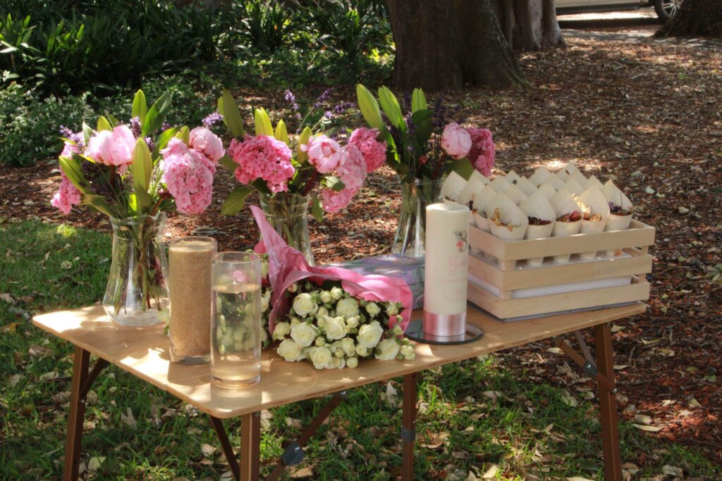 non-religious-christening-setup-outdoors-with-candles-and-water