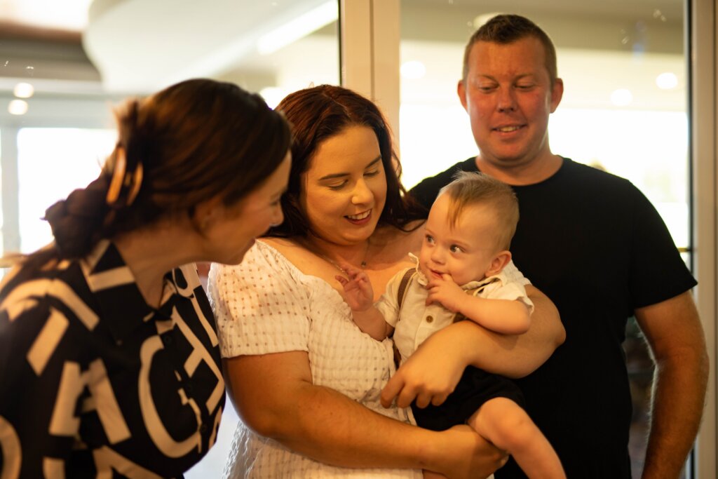 julie-muir-with-the-parents-during-the-non-religious-christening-of-oliver